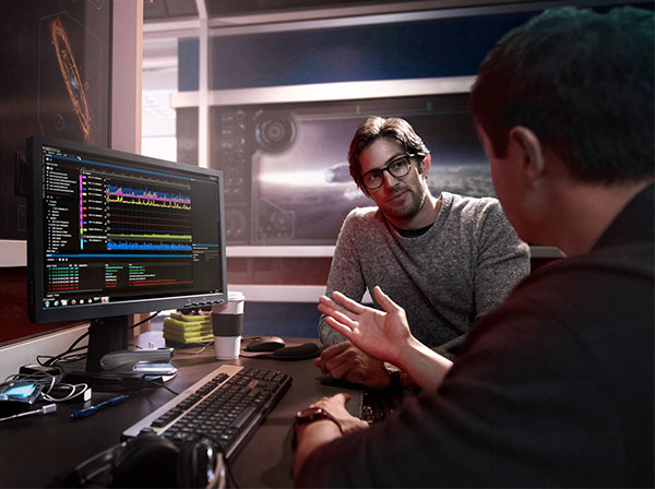 2 men in front of computer discussing Hexagon SDK 3.1