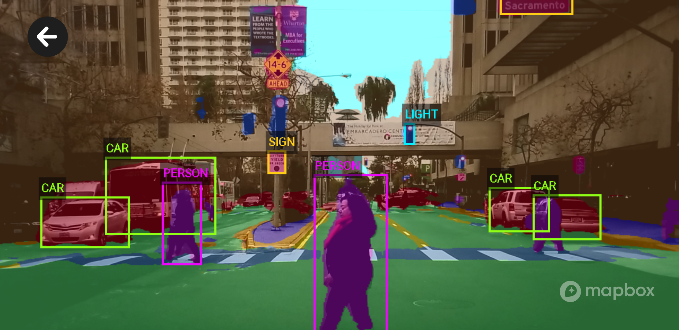 Image of Mapbox Android Vision SDK simultaneously identifying objects in traffic.